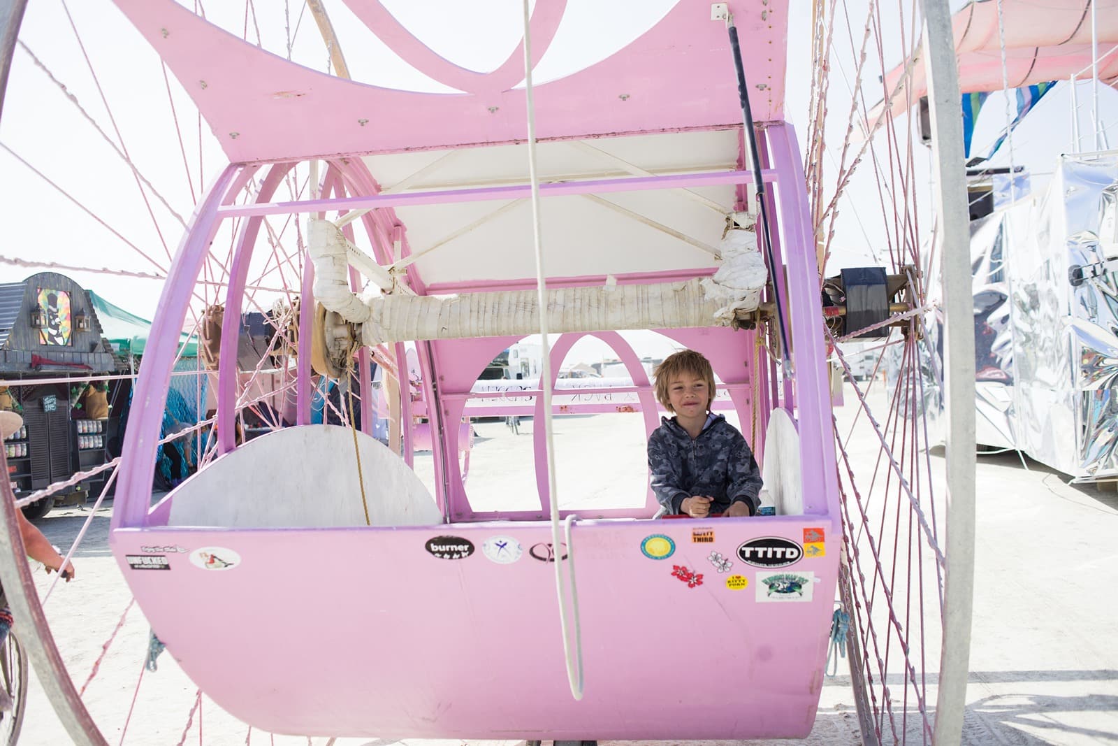 Burning Man - Young boy in big wheels art car