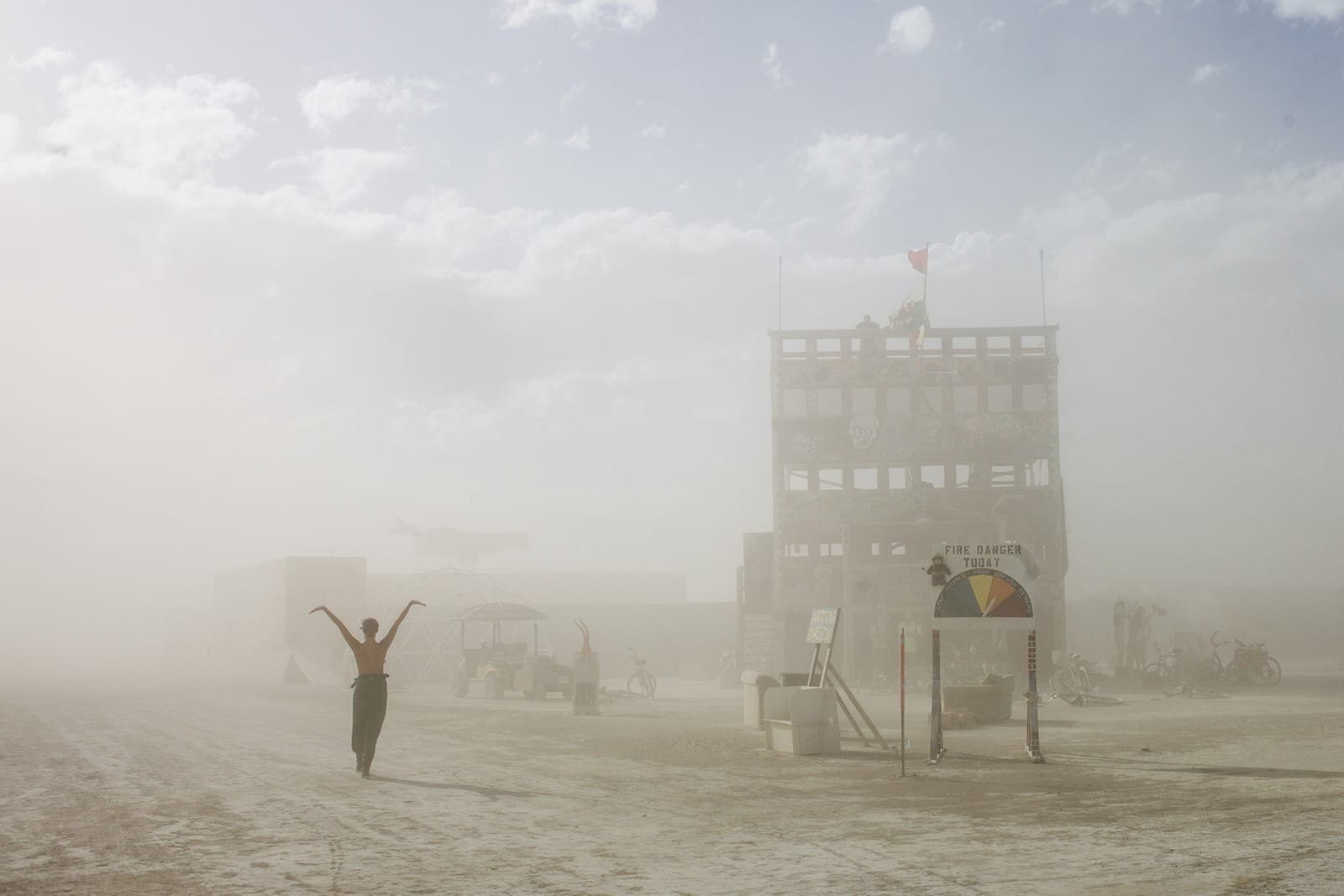 Burning Man - The girl and the firehouse during the sandstorm